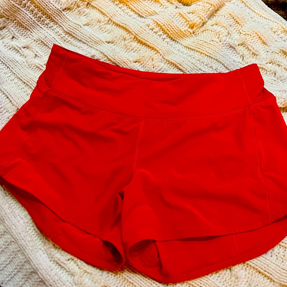 Lululemon Coral color size 8 tall shorts.  EUC